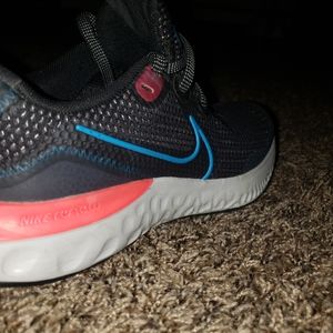 Nike size 4.5 youth boys running shoes blue and orange,